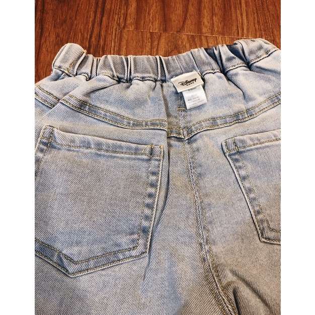 Quần short jeans lửng form thụng 6 cúc Disney du xin bé gái