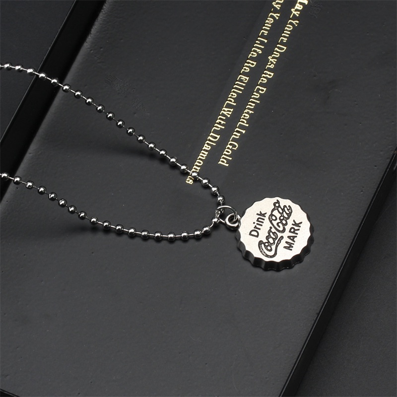 Dây chuyền bi titan không đen không rỉ mặt co ke