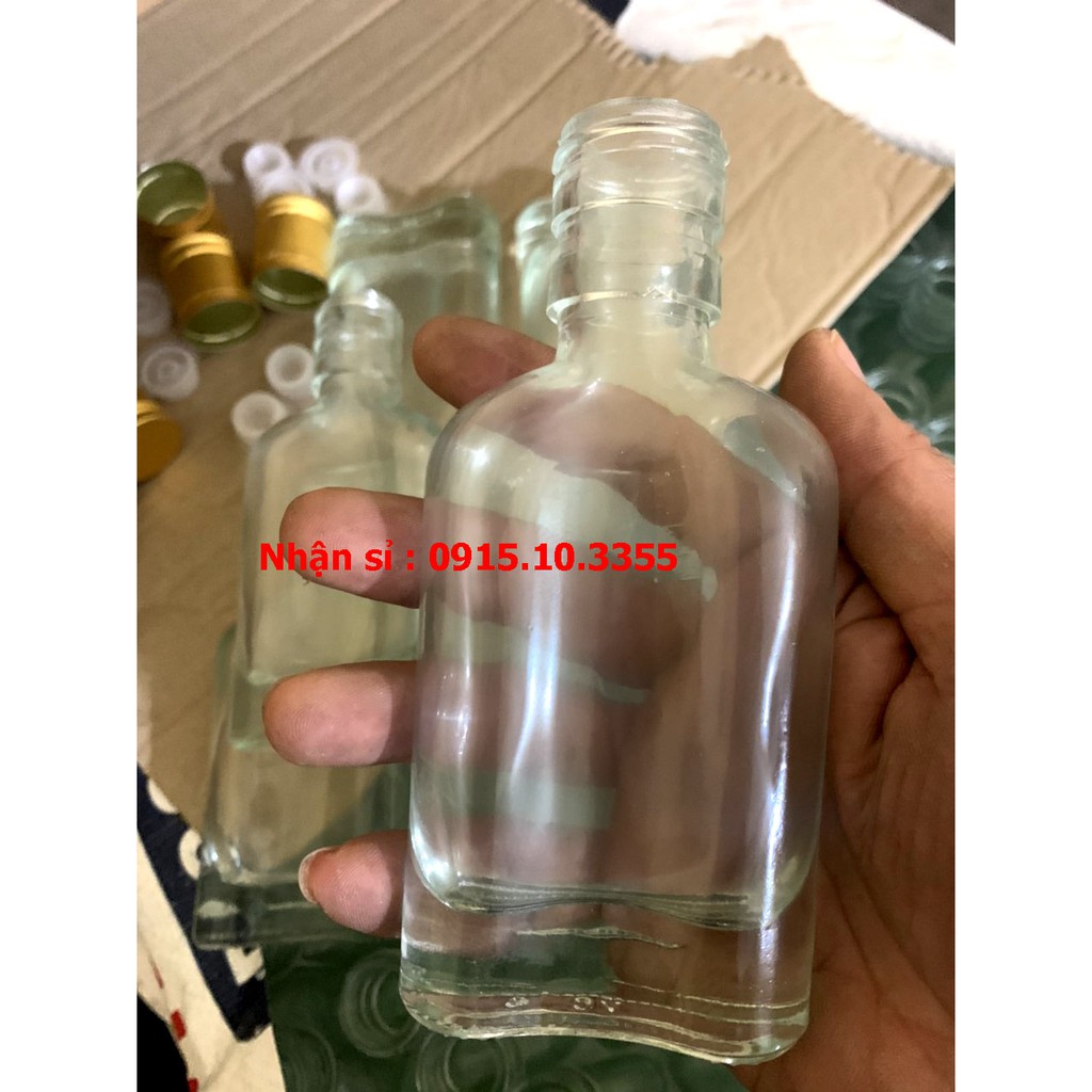 VỎ CHAI THỦY TINH 100ML ( CHẠI DẸT , NẮP ĐỒNG ,NHỎ GIỌT)