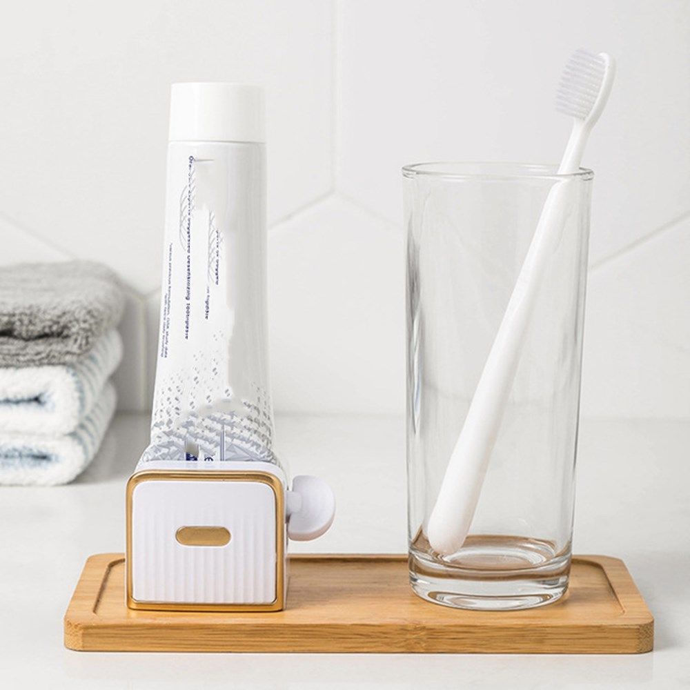 Dụng cụ hỗ trợ bóp tuýp kem đánh răng bằng nhựa dán tường tiện lợi