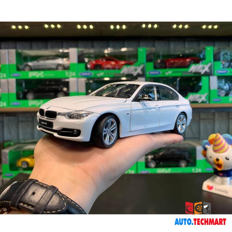 Xe mô hình hợp kim siêu xe BMW 335i tỉ lệ 1:24 hãng Welly màu trắng