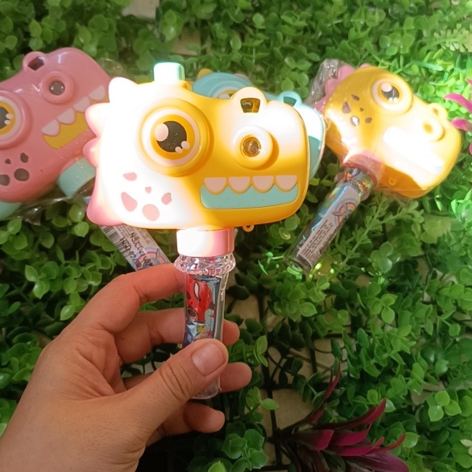 Kẹo đồ chơi máy ảnh khủng long chiếu hình có pin