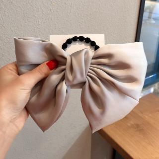 Kẹp tóc phối họa tiết nơ dễ thương cho nữ