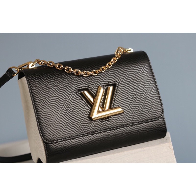Túi xách tay nữ phom cứng có dây đeo khoá logo chữ một ngăn to louis vuitton Lv
