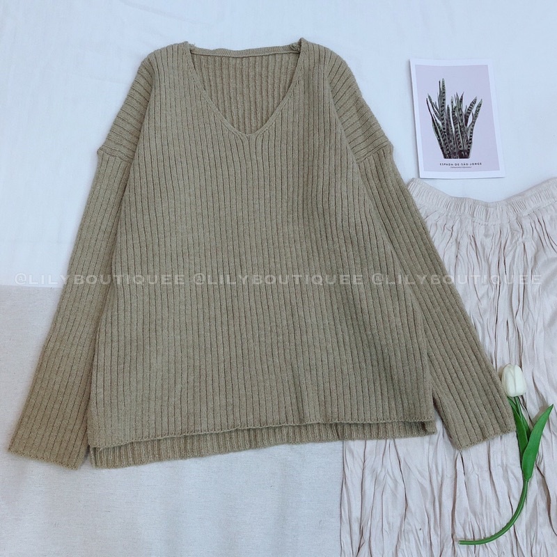 Áo len dọc cổ tim