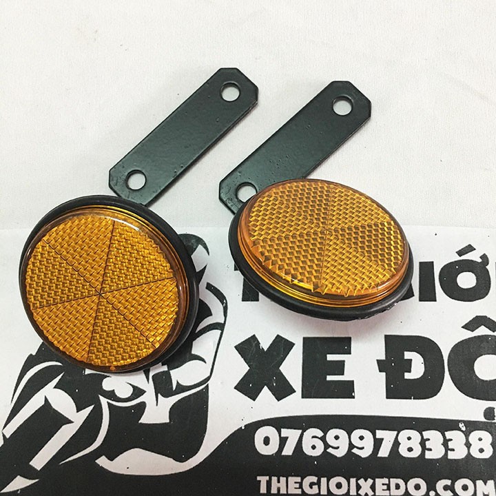 Cặp mắt mèo phản quang tròn gắn phuộc trước xe máy