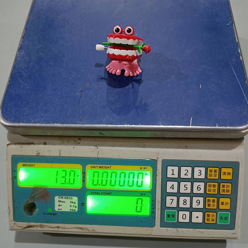 Đồ chơi lên dây cót hình hàm răng dễ thương cho bé