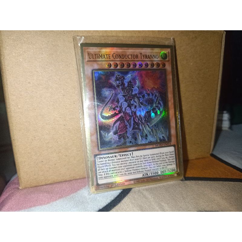 thẻ bài: Ultimate Conductor Tyranno - MGED-EN014 - Premium Gold Rare 1st Edition
