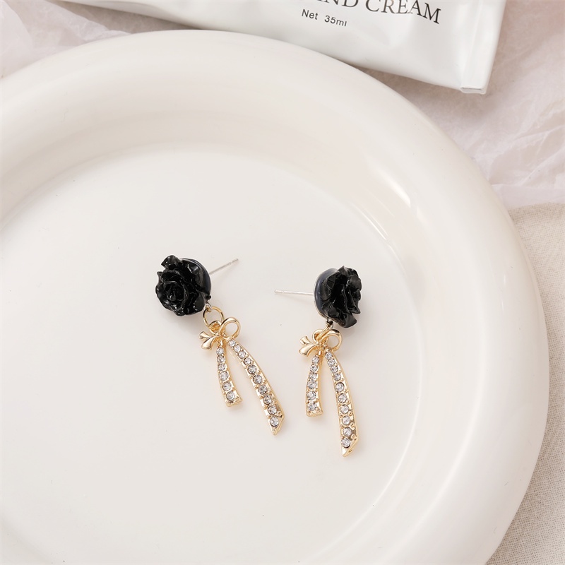 Khuyên tai kẹp không bấm lỗ chốt cố định K025 bằng hợp kim mạ bạc hình bông hoa kèm nơ đính đá dáng midi Leous