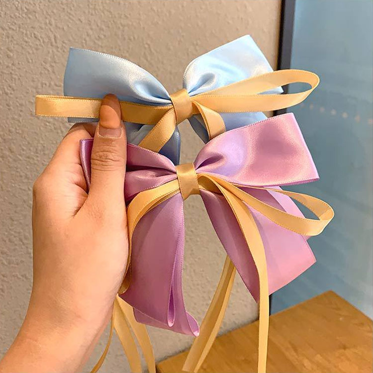 Kẹp tóc hình ruy băng xinh xắn cho nữ