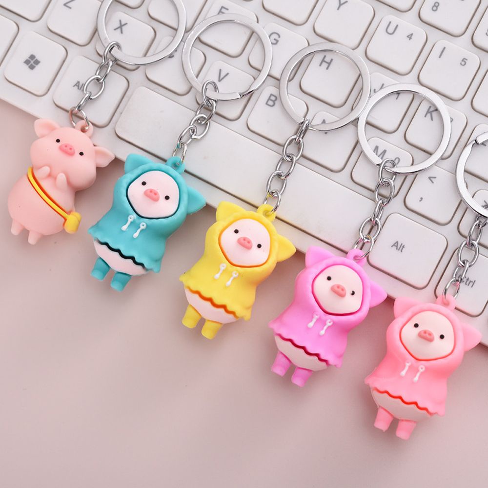 Móc khóa hình chú heo mặc áo mưa bằng silicon dễ thương dành cho nam và nữ