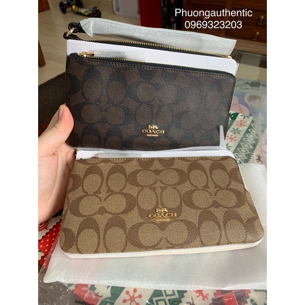 Ví cầm tay Coach logo signature canvas AUTHENTIC