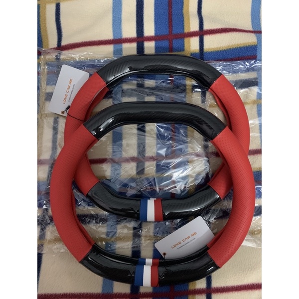 Bộc vô lăng Peugeot 2008/3008/5008 vân carbon đen đỏ cờ pháp