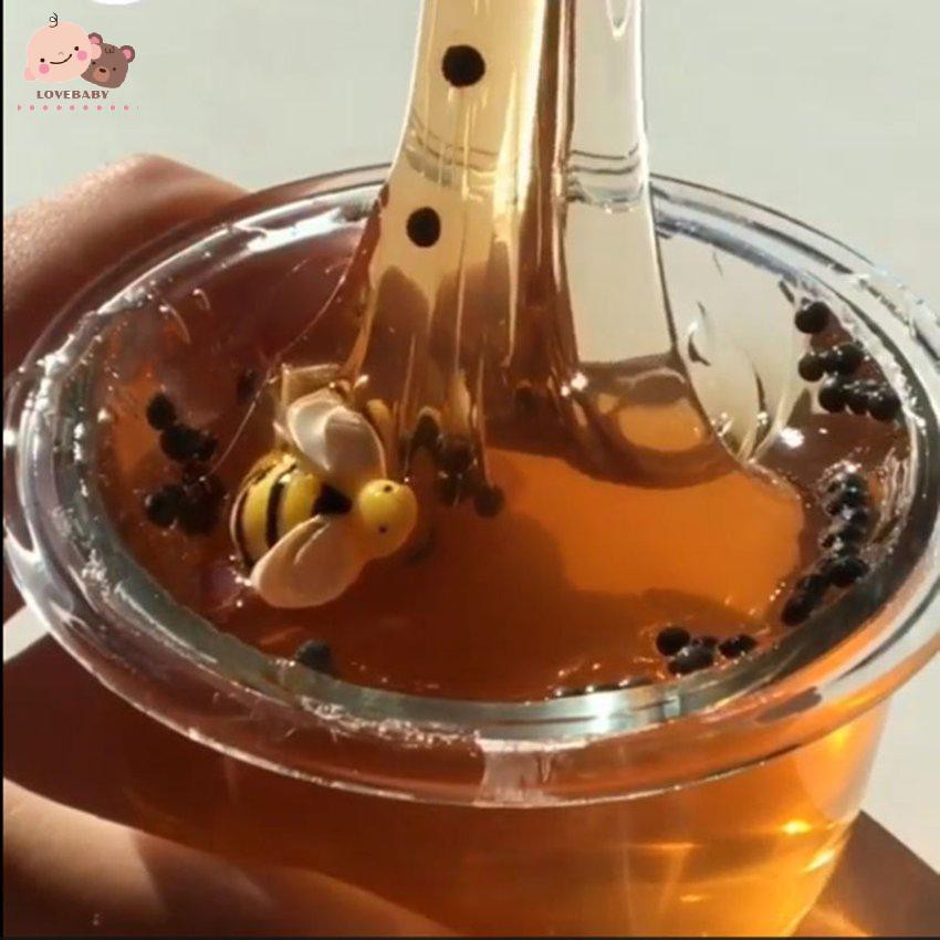 Đồ chơi slime polymer màu mật ong trong suốt phối hình chú ong