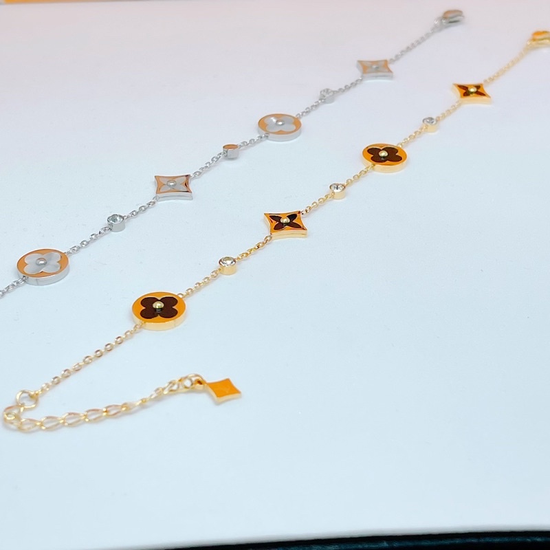 Lắc tay titan V trắng - vàng ko đen