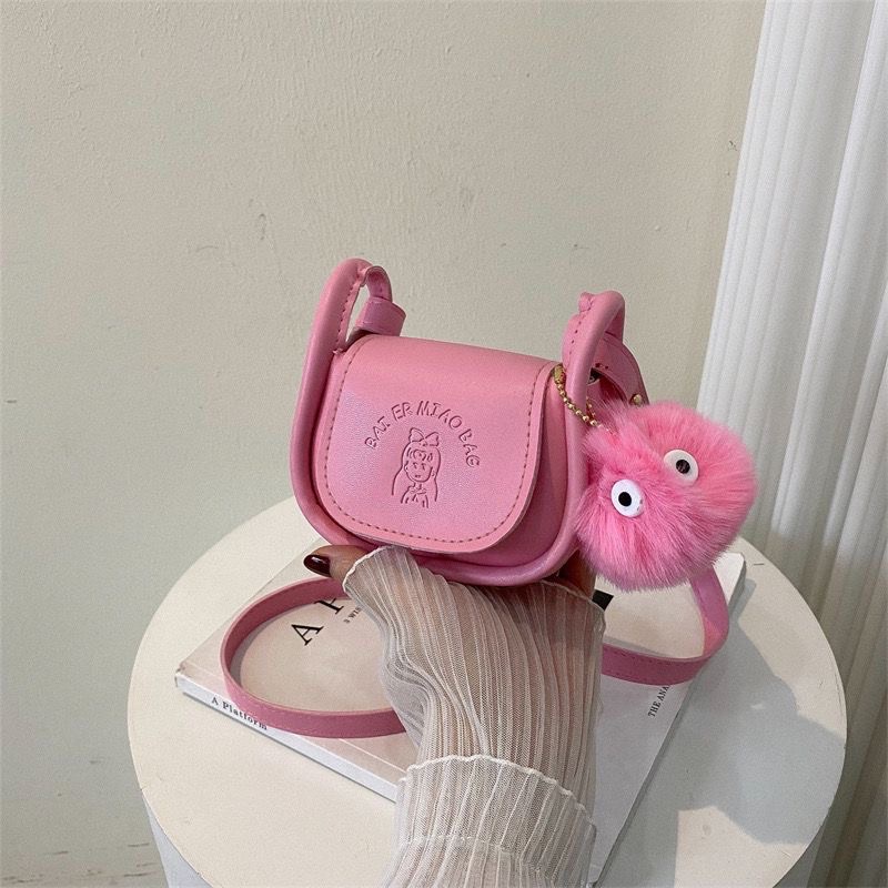 Túi mini nữ nhỏ nhắn kèm cục bông
