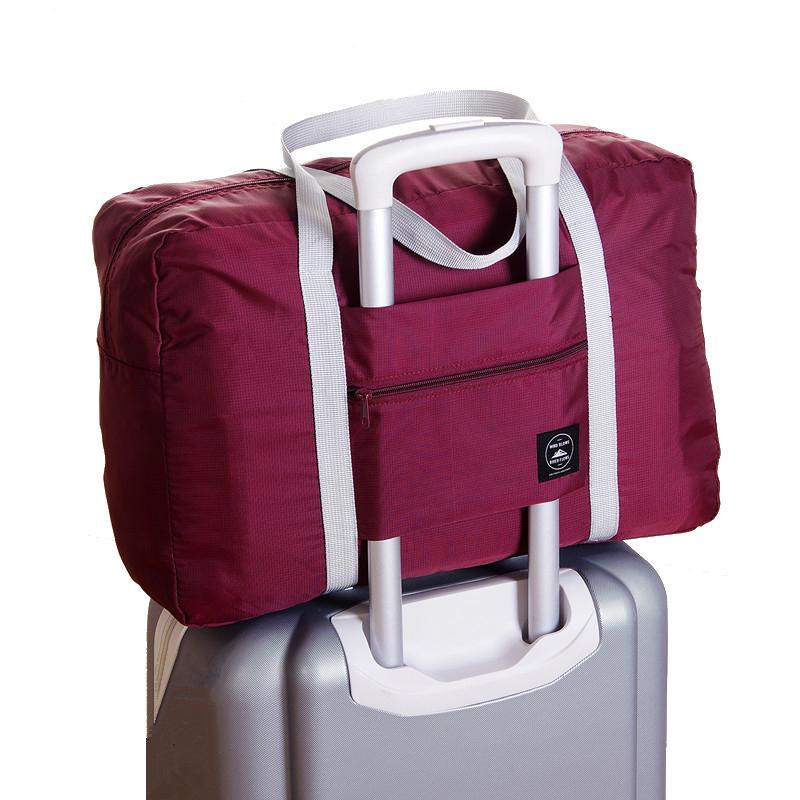 Túi Du Lịch Cỡ Lớn Có Bánh Xe Kéo Chất Liệu Nylon Chống Thấm Nước Có Thể Gấp Gọn Tiện Dụng Cho Nữ