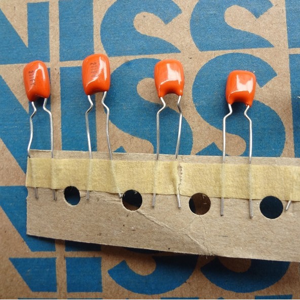 A03 Tụ điện màu vàng 100V 270pF 271F 1% NISSEI (01 con)