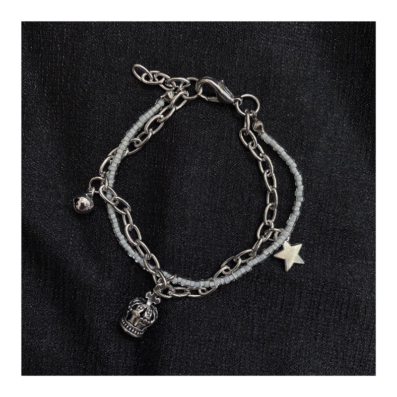 Vòng cườm trắng mix charm