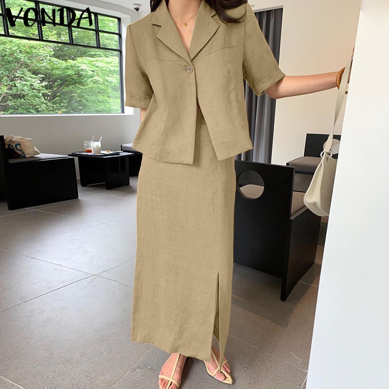 Bộ VONDA gồm áo ngắn tay màu trơn cổ bẻ + chân váy dài lưng cao phối khóa kéo cá tính dành cho nữ