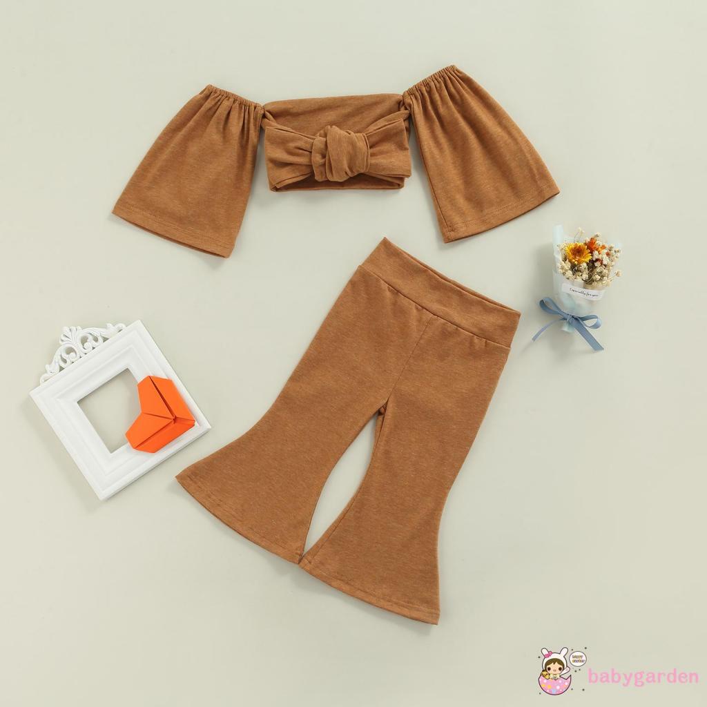 Set đồ 2 món áo croptop trễ vai thắt nơ + quần ống loe màu trơn cho bé gái