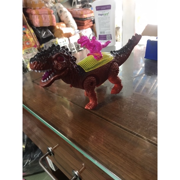 Khủng Long pin cõng con nhạc đèn ( tặng kèm pin)