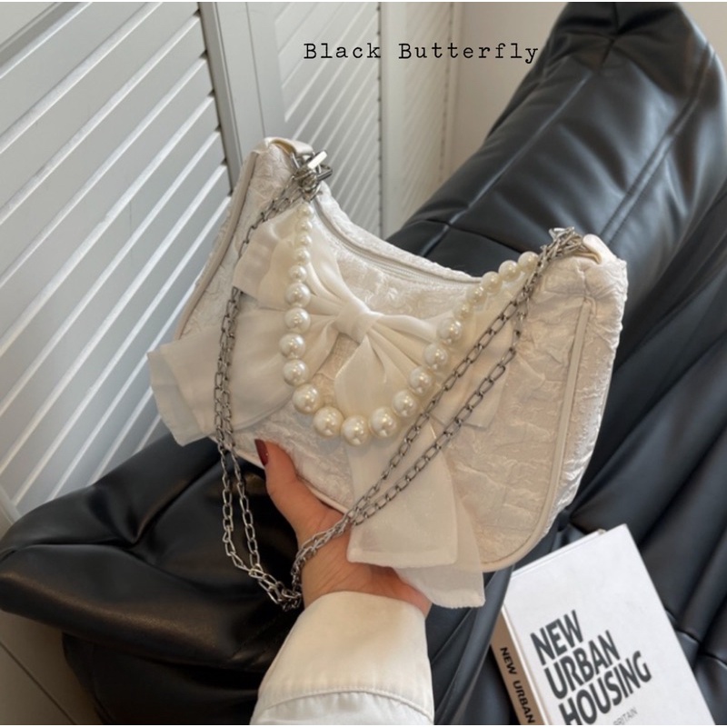 Túi đeo chéo đính nơ vải sần Butterfly