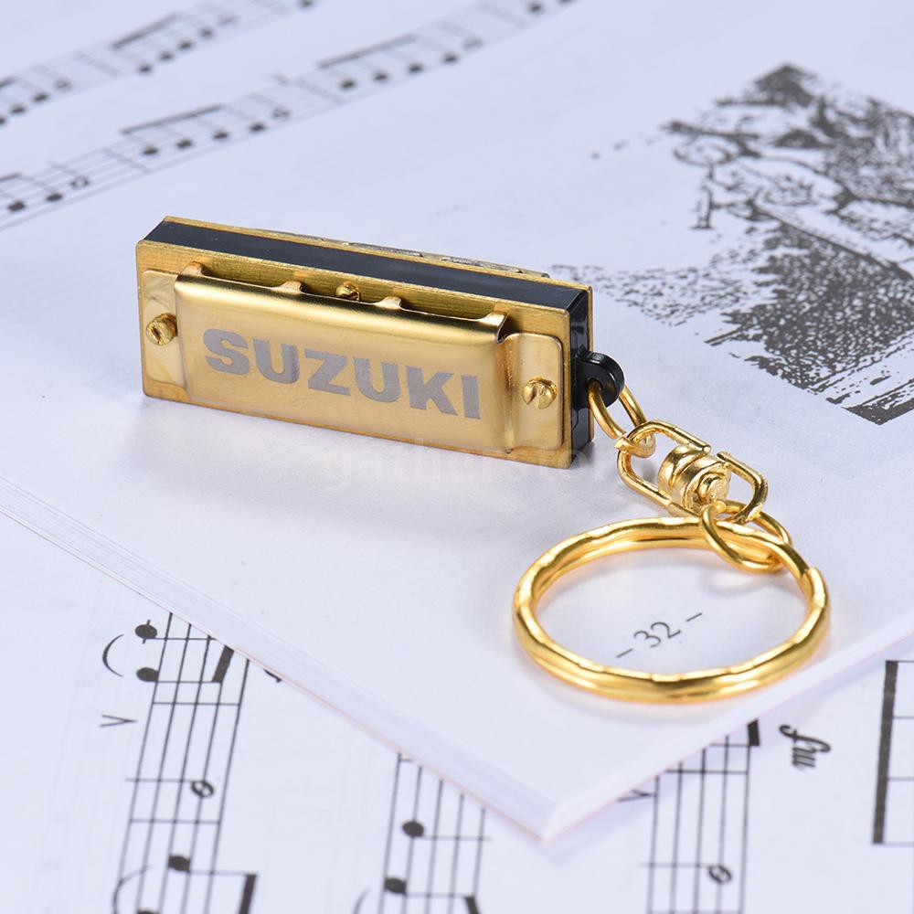 Kèn Harmonica mini 10 tông 5 lỗ phím C có gắn móc khóa logo Suzuki màu vàng kim