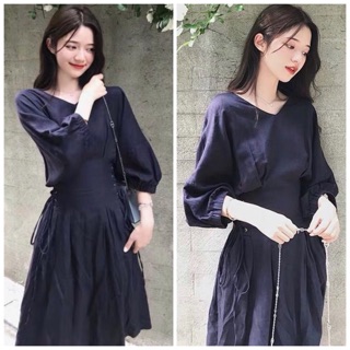 Đầm đen tay lỡ đan dây eo