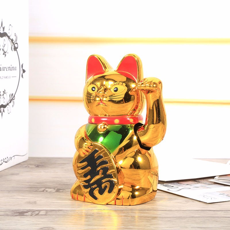 Mèo vàng thần tài vẫy tay phong thủy