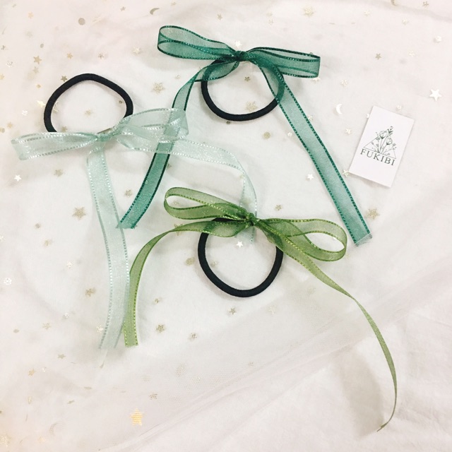 CỘT TÓC NƠ VOAN NHŨ ẢNH THẬT