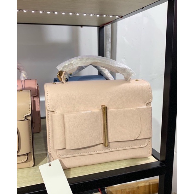 Túi cnk nơ hồng Nude