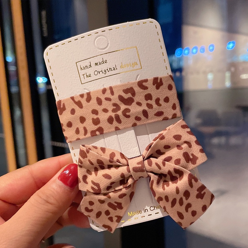 Kẹp tóc hình nơ họa tiết da báo phong cách retro dành cho nữ