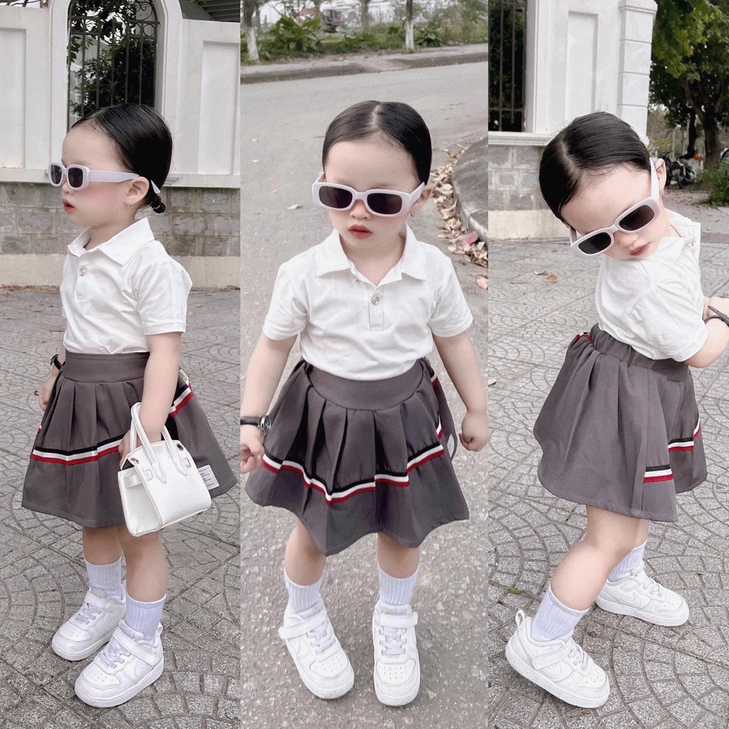 Set váy áo polo chân váy xếp ly họa tiết sau cho bé