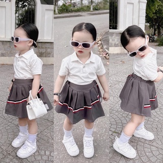 Set váy áo polo chân váy xếp ly họa tiết sau cho bé