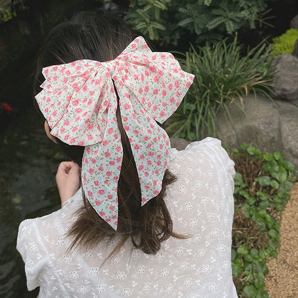 Kẹp tóc đính nơ dễ thương xinh xắn dành cho phái nữ