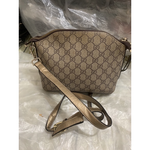 Túi đeo chéo dáng hến Vân GD hàng si