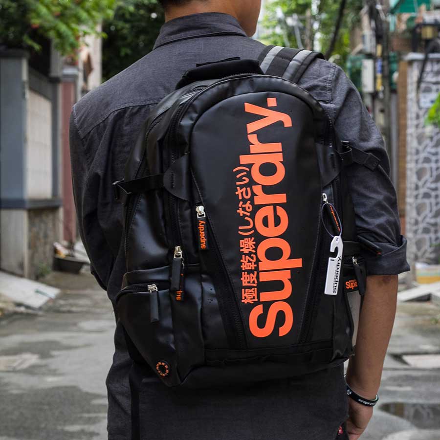 Balo Chống Thấm Tốt Superdry Classic Tarpaulin - màu đen chữ cam