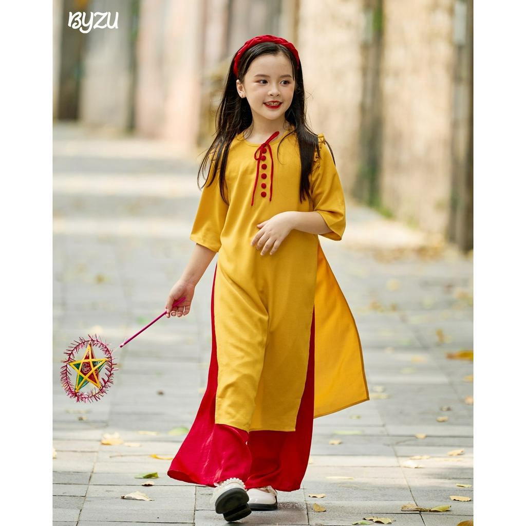 Áo Dài Bé Gái BYZU Thiết Kế Cổ Tròn Tay Lỡ, Vải Lụa Cao Cấp Màu Vàng ADT2201