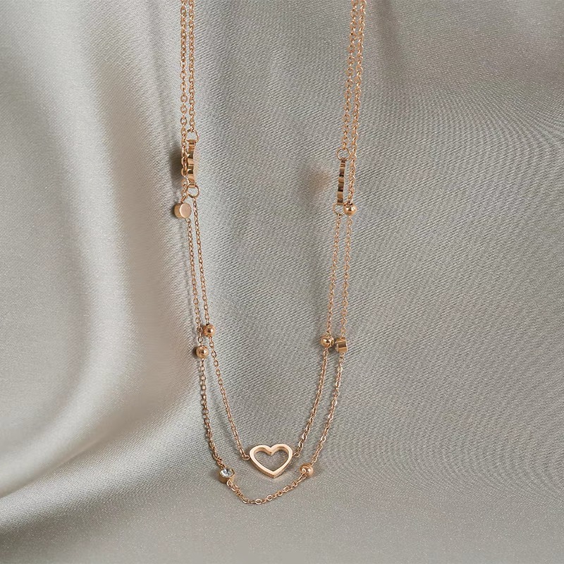 Dây chuyền hai lớp bằng thép titan mạ vàng 18K mặt hình trái tim nhỏ rỗng chống dị ứng/nước thời trang đơn giản cho nữ