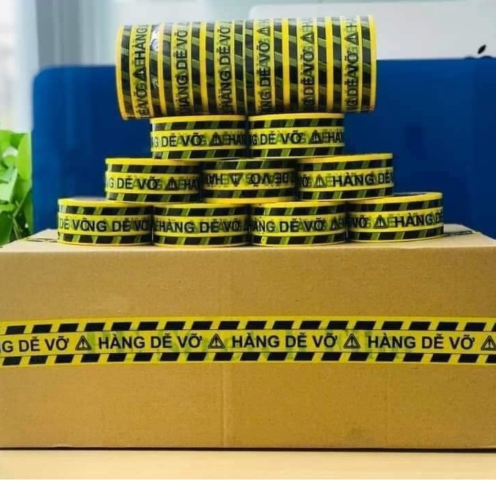 [1 CÂY] Băng keo niêm phong  hàng dễ vỡ màu vàng   ( 6 cuộn /1 cây) đóng hàng giá tại xưởng