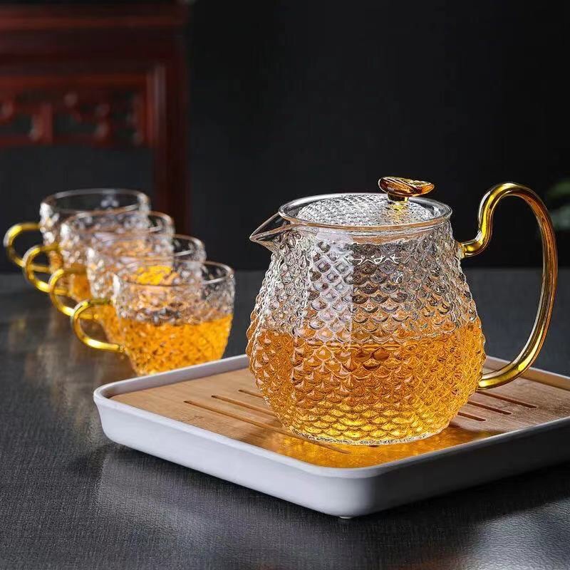 Set 1 ấm + 6 chén thuỷ tinh sần quai vàng