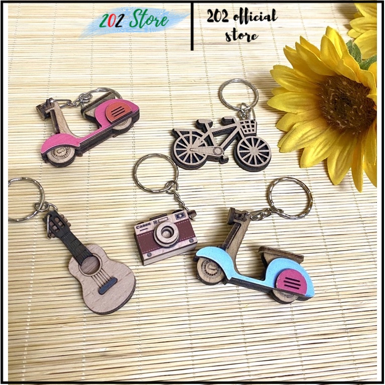 Móc chìa khoá gỗ handmade hình xe máy vespa, xe đạp , cây đàn guita, máy ảnh độc đáo, tặng người yêu, bạn bè