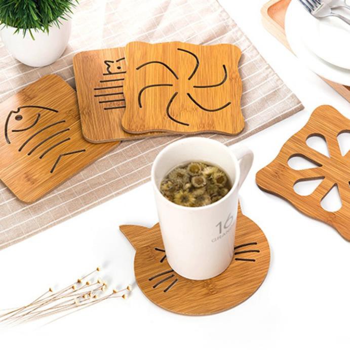 Đế lót xoong nồi, chén bát cách nhiệt bằng gỗ có chân cao su chống trơn trượt.