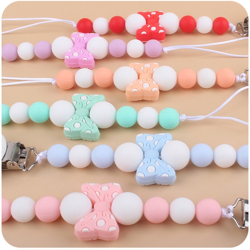 Kẹp Núm Vú Giả Bằng Silicon Hình Nơ Dễ Thương Cho Bé Sơ Sinh Mọc Răng