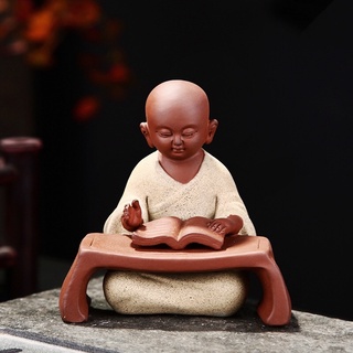 Tượng chú tiểu đọc kinh gốm tử sa