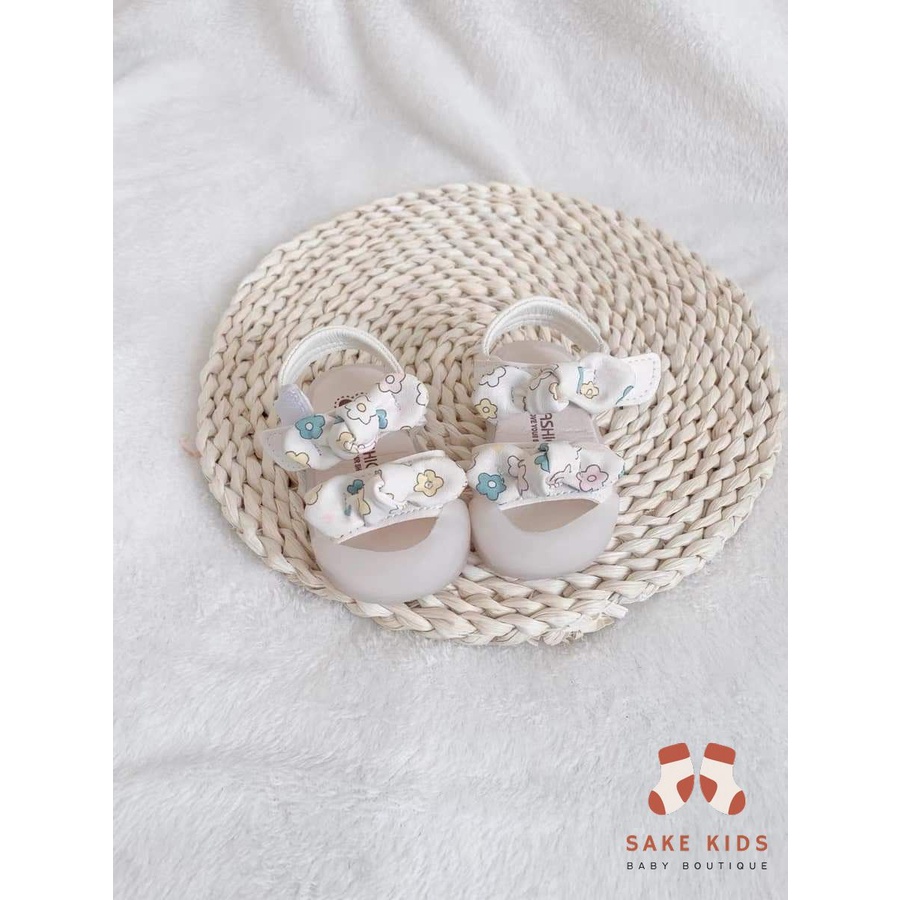 Sandal tập đi chống vấp phối nơ hình Bông hoa mũi có đế chống trơn trượt kiểu dáng Hàn Quốc mới nhất M865