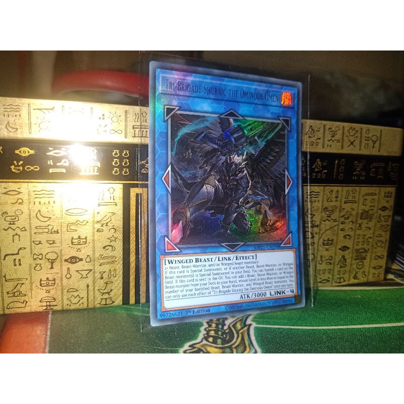 Thẻ bài:Tri-Brigade Shuraig the Ominous Omen - MP21-EN198 - Ultra Rare 1st Edition