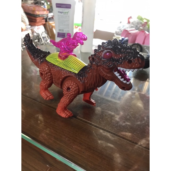 Khủng Long pin cõng con nhạc đèn ( tặng kèm pin)