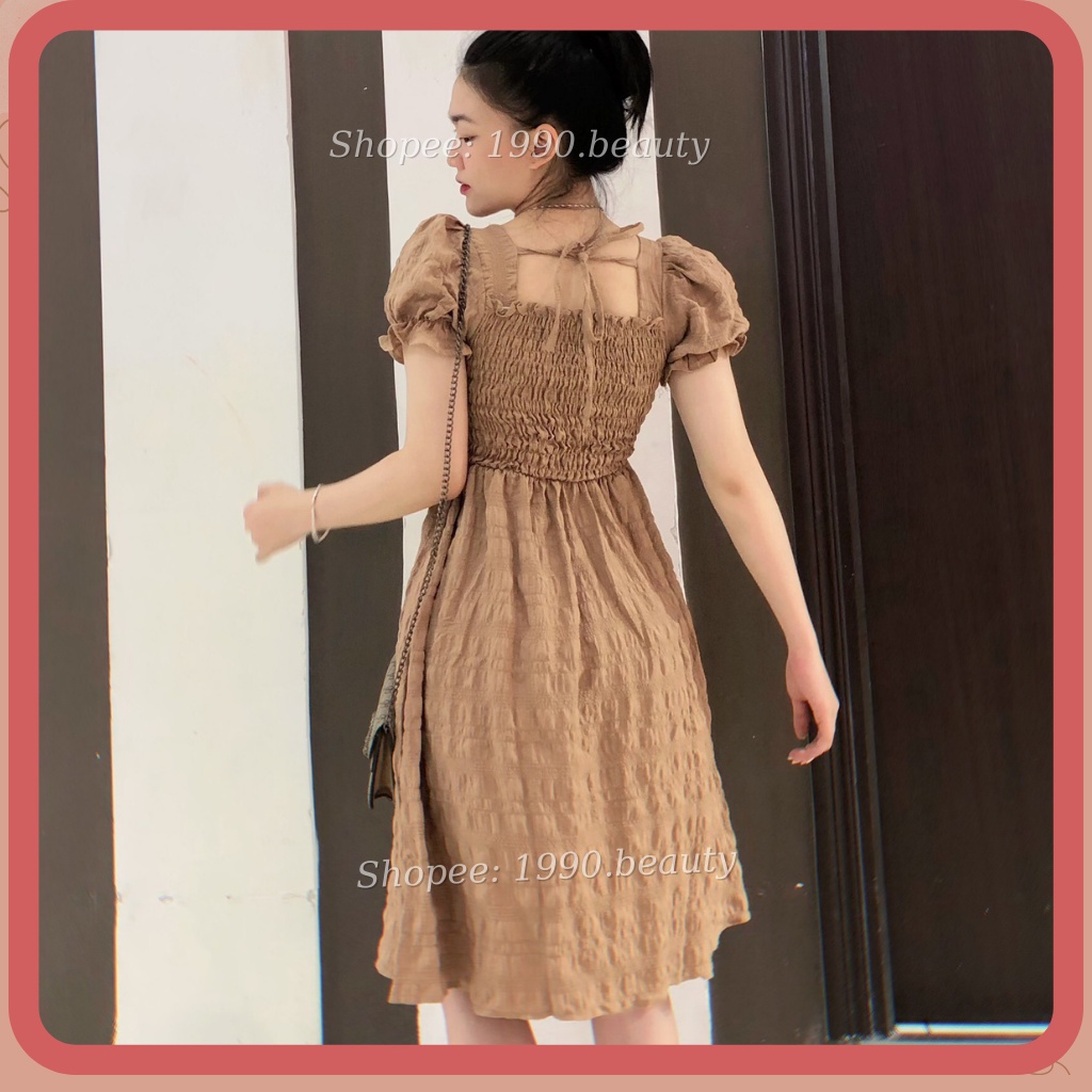 Váy nữ tiểu thư đầm nữ sang chảnh cổ vuông tay bồng thắt dây sau váy babydoll chun ngực chun tay nơ sau điệu đà màu trắn